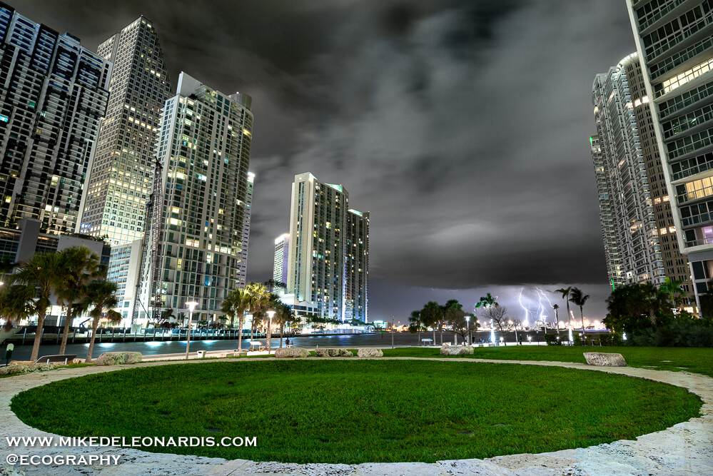 Miami, Florida - The Miami Circle is perhaps one of the oldest structures in the US at possibly 2,000 years old. There were 24 holes dug forming a perfect circle. Examination of the earth revealed numerous archaeological artifacts, ranging from shell-tools and stone axe-heads to human teeth and charcoal from fires. <br><br>I had wanted to get a picture of the Miami Circle for years but there was either not a good storm, or too many people in the area. Fortunately on this night there were few people and a nice storm. <br>