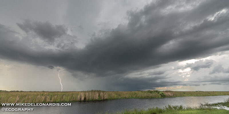 Florida Everglades - Distant summer thunderstorm over the Florida Everglades<br><br>I drove through this thunderstorm to angle the shot so there was a body of water in front of the storm. After about 20 minutes I was finally able to get a lightning strike just as the storm was moving too far away for any kind of shot.