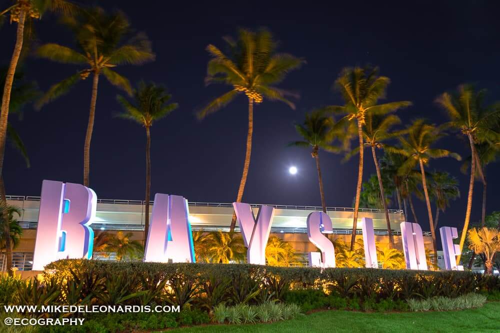 Miami, Florida - Full Moon rising over Bayside Marketplace in Miami, FL. Bayside is a major tourist attraction in Miami with tons of restaurants, shopping, boat tours, and live performances.