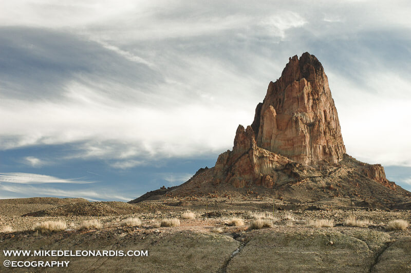 Arizona - Agathla Peak<br><br>Agathla Peak is an eroded volcanic plug consisting of volcanic breccia cut by dikes of an unusual igneous rock called minette. It is one of many such volcanic diatremes that are found in Navajo country of northeast Arizona and northwest New Mexico. Agathla Peak and Shiprock in New Mexico are the most prominent. These rocks are part of the Navajo Volcanic Field, in the southern Colorado Plateau. Ages of these minettes and associated more unusual igneous rocks cluster near 25 million years.